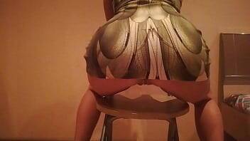 Erotic dance on a chair in a dress made of snake skin on girlsporntube.one