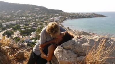 Beautiful Teen Couple In Love Passionately Kissing Above The Sea On Crete Island on girlsporntube.one