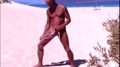 Tanned guy on beach in tiny string thong (temporarily!) on girlsporntube.one