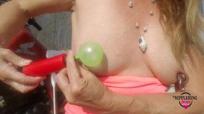 Nippleringlover Horny Milf Sticking Balloons Through Extreme Stretched Pierced Nipples Outdoors on girlsporntube.one