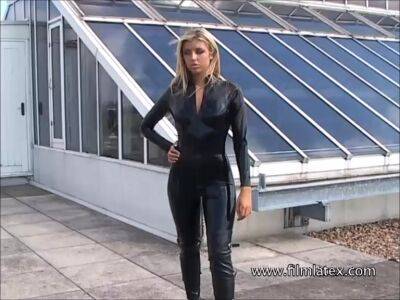 Blonde latex-babes outdoor knee boots and high heels of fetish girl in tight full body rubber outfit with softcore glamour model Karina outside on the roof on girlsporntube.one