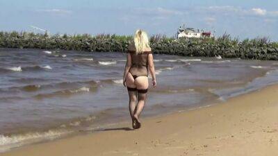 Pretty Woman In A Nylon Bodysuit On The Beach on girlsporntube.one