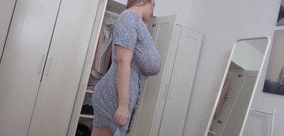 BBW blonde reveals her giant jugs while undressing on girlsporntube.one