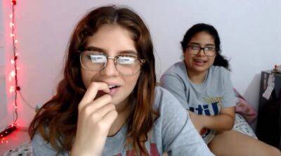 Two nerdy latinas playing with their pussies on cam on girlsporntube.one