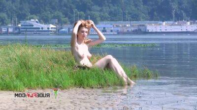 Playful blond nudist teen caught on camera naked at the beach on girlsporntube.one