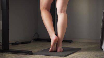 Watching Teen Calves At Standing Desk on girlsporntube.one