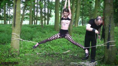 Submissive teen tied up in the woods on girlsporntube.one