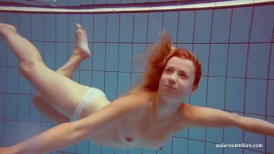 In The Indoor Pool, A Stunning Girl Swims on girlsporntube.one