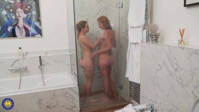 Mature star Effie Gold enjoys a steamy lesbian shower with Karry on girlsporntube.one