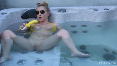 Sweet blonde inserts big dildo in her shaved pussy while in the pool on girlsporntube.one